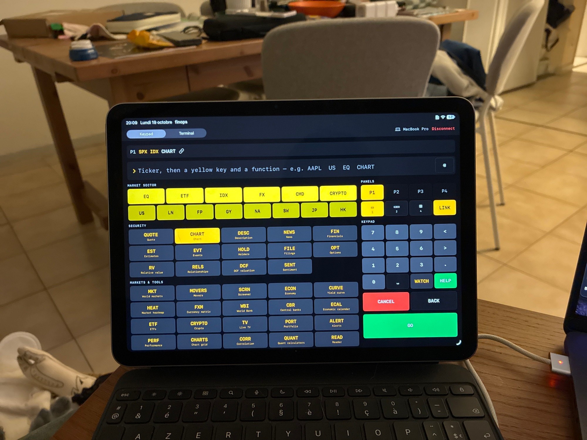 The iPad in Keypad mode: yellow market keys, function keys, red CANCEL and green GO